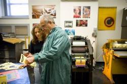 Instructor showing student printing techniques